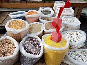 Sacks of grain and legumes in the bazaar. Sale of food to consumers. Stocks of provisions for housewives. Private business. Beans,