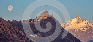 The Sacra di San Michele Saint Michael Abbey , the symbol of the Italian region of Piedmont, In the background the mountains of