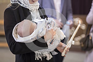 The sacrament of baptism. Attributes of an Orthodox priest for baptism. baptism Christening the baby. Child and God