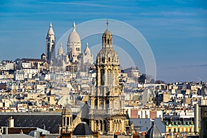 Sacre Coeur Basilica in Montmartre and Trinity Church. Paris, France