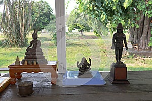 A sacred Buddha image that Buddhists worship with flowers.