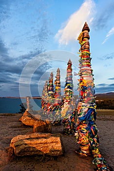 Sacred buryat place on Olkhon island with beautiful sky and clouds, lake Baikal, Russia photo