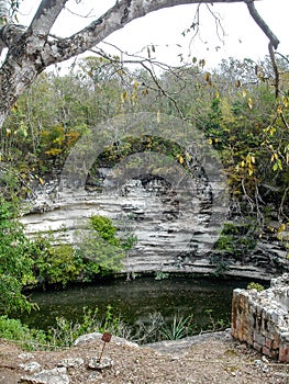 The Sacred Cenote refers to a noted cenote at the pre-Columbian Maya archaeological site of Chichen Itza, in the northern YucatÃÂ¡n photo