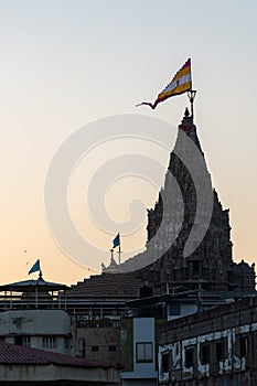 sacred dwarkadish temple architecture framed by glowing sunrise