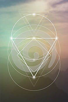 Sacred geometry symbol on colorful background.