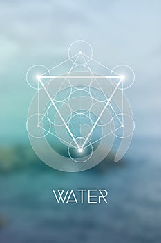 Sacred geometry Water element symbol inside Metatron Cube and Flower of Life in front of natural blurry background