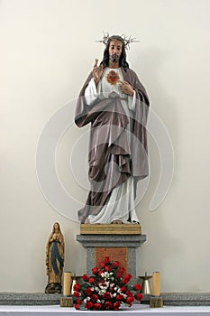 Sacred Heart of Jesus, statue on the altar in parish church of the St Mary Magdalene in Kapela, Croatia photo