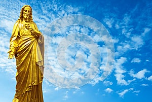 The Sacred Heart statues over cloudy sky