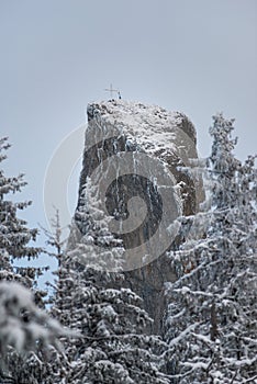 Sacred Heights: Close-Up of Cross Atop Piatra Mare Rock in Rarau