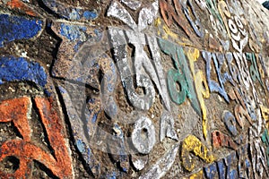 Sacred mani stones with tibetan inscribed mantra