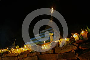 Sacred pagoda flanking with ritual candles,incense,lotus photo