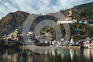 Sacred Rewalsar lake with big golden statue of Padmasambhava