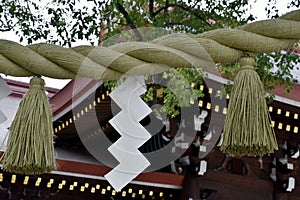 Sacred rice straw rope in Shinto shrine and temple photo