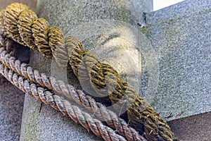 Sacred rope, or shimenawa, at torii gate to small local shinto shrine, Kanazawa, Japan