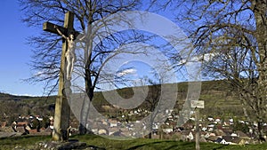 Sacred Silhouette: The Mission Cross of Kuppel Overlooking the Quiet Town of Buhl, Alsace photo