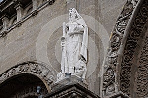 The sacred statue of St. Andrew the Apostle in front of the beautiful detailed arch of Manila Cathedral, Intramuros, Manila,