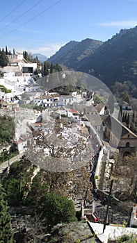 The Sacromonte gipsy caves in the Spanish city of Granada. View of the Darro Valley opposite to the famous Alhambra site.