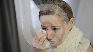 Sad abused woman with brown eyes crying, parting with your loved one