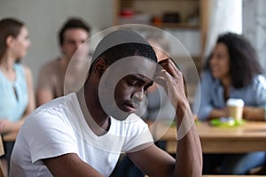 Sad African American man suffering from bullying or racial discrimination