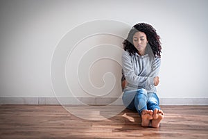 Sad afro american woman portrait at home