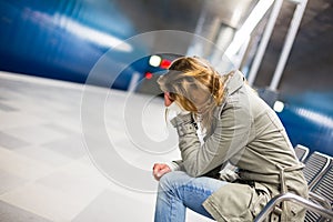 Sad and alone in a big city - Depressed young woman photo