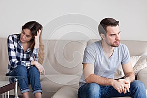 Sad angry husband ignoring avoiding talk to cheating bad wife