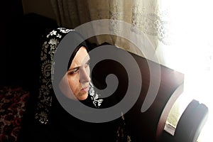 Sad arab muslim woman staring