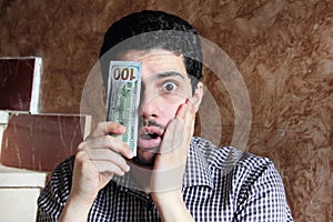 Sad arab young businessman with dollar bill money