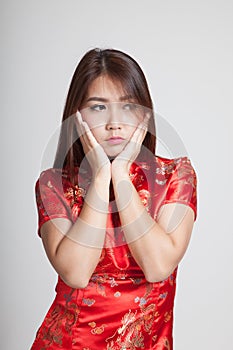 Sad Asian girl in chinese cheongsam dress
