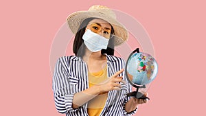 Sad Asian Woman Holding Globe, Wearing Face Mask