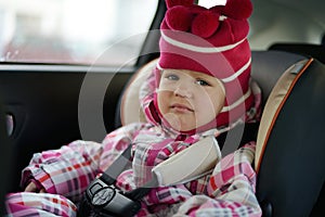 Sad baby in car seat