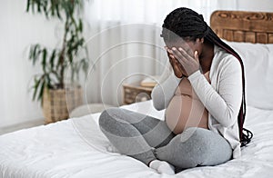 Sad Black Pregnant Woman Crying At Home, Having Maternity Depression