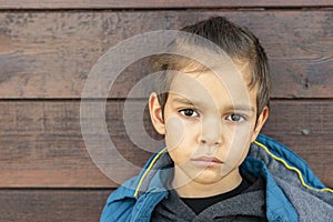 Sad bored little boy with nosebleed photo