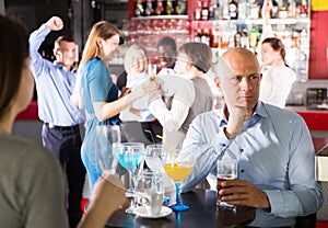 Sad bored man at corporate party