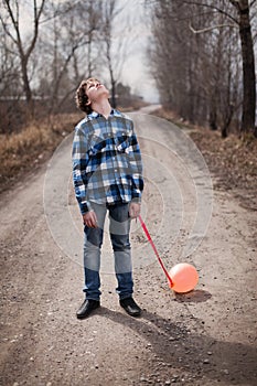 The sad boy with a balloon