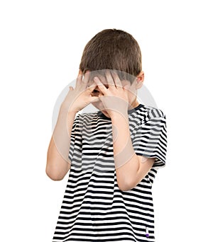 Sad boy covers his face hands