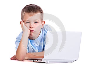 Sad boy with laptop on white