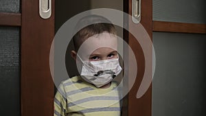 Sad boy in medical mask, looking at camera despleased . Virus protection, pandemic, prevention epidemic.