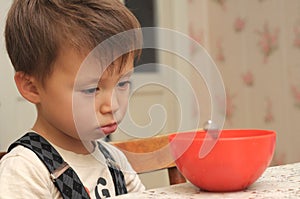 Sad boy refusing to eat