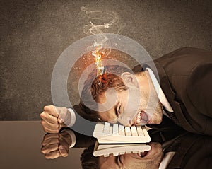 Sad business person`s head catching fire