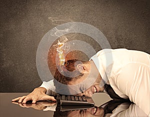 Sad business person`s head catching fire