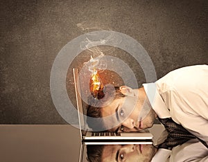 Sad business person's head catching fire