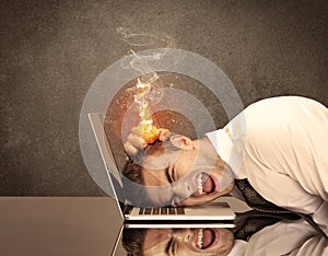 Sad business person`s head catching fire