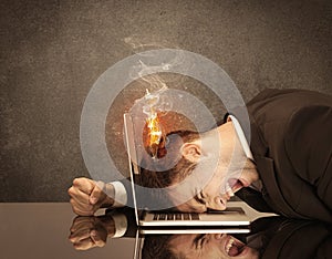 Sad business person`s head catching fire