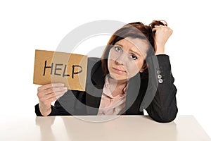 Sad business red haired woman in stress at work asking for help