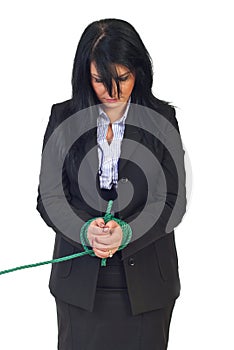 Sad business woman tied up