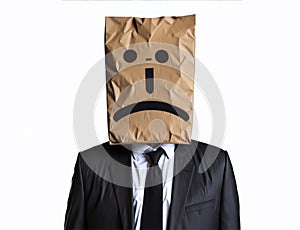 A sad businessman with a paper bag on his head, bearing an emoji emotion face