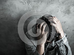 Sad businessman sitting head in hands. negative thinking concept, emotion portrait photo