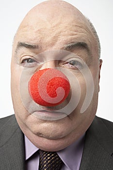 Sad Businessman Wearing Clown Nose