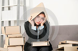 Sad busy secretary with folder on head, stressed overworked business woman too much work, office problem. Tired stressed